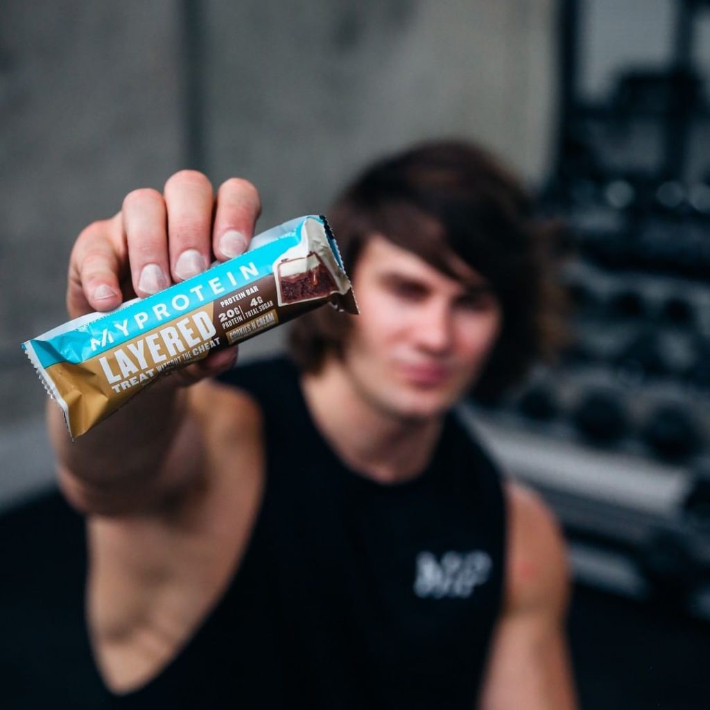 holding a impact protein bar